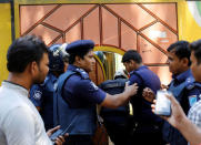 Security personnel enter a house after a gunbattle with militants on the outskirts of Dhaka, Bangladesh, August 27, 2016. REUTERS/Mohammad Ponir Hossain