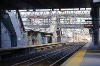 A man walks the Stamford Metro North train station Tuesday, Dec. 29, 2020, in Stamford, Conn. With many New Yorkers moving to neighboring Connecticut during the pandemic, especially Fairfield County, it's becoming more challenging for people to find affordable homes to buy. (AP Photo/Frank Franklin II)