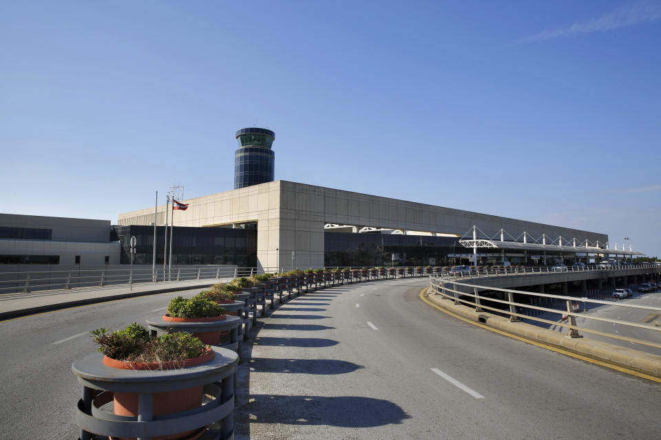 The empty entrance of the Rafik Hariri International Airport is seen during a strike in Beirut, Lebanon, Friday, Jan. 4, 2019. Parts of Lebanon's public and private sectors have gone into a strike called for by the country's labor unions to protest worsening economic conditions and months of delays in the formation of a new government. (AP Photo/Bilal Hussein)