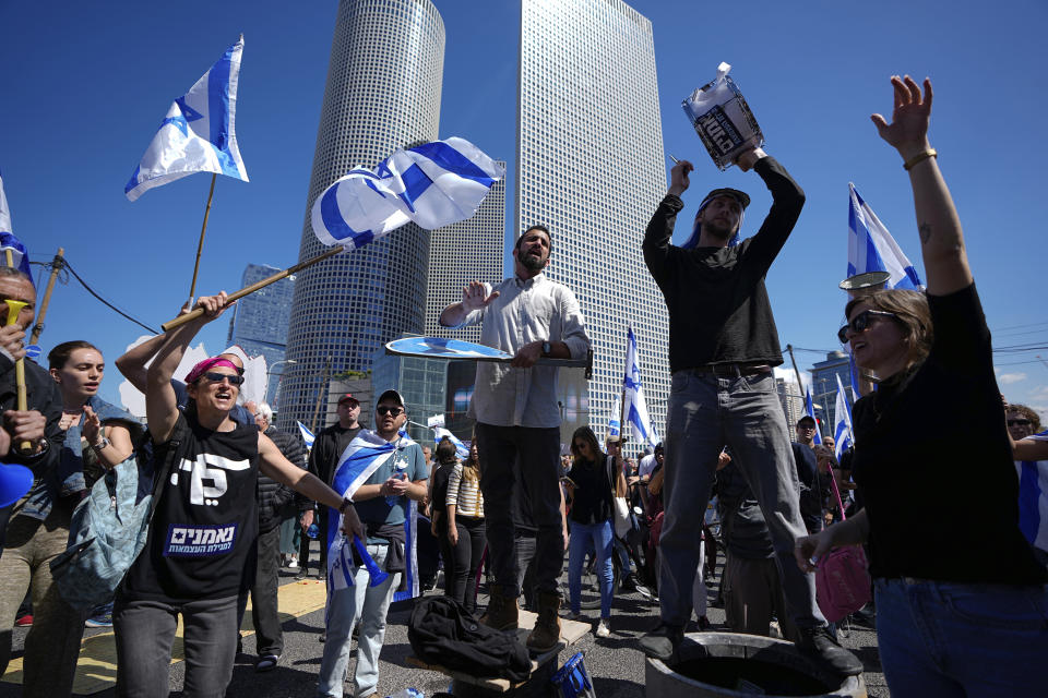 Israelis protest against plans by Prime Minister Benjamin Netanyahu's new government to overhaul the judicial system, in Tel Aviv, Israel, Thursday, March 9, 2023. (AP Photo/Ariel Schalit)