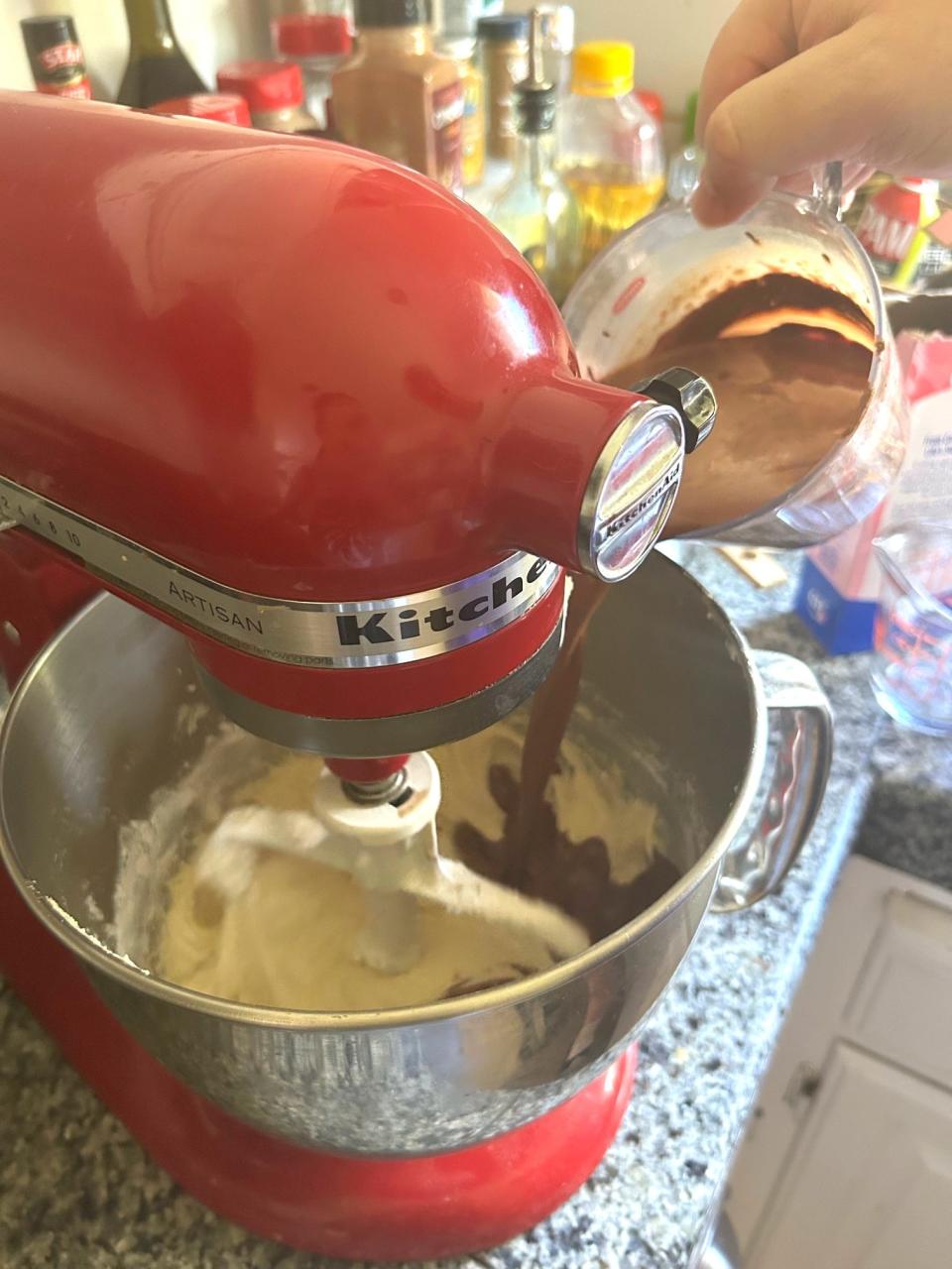 Adding chocolate to Ina Garten's chocolate cake with mocha frosting