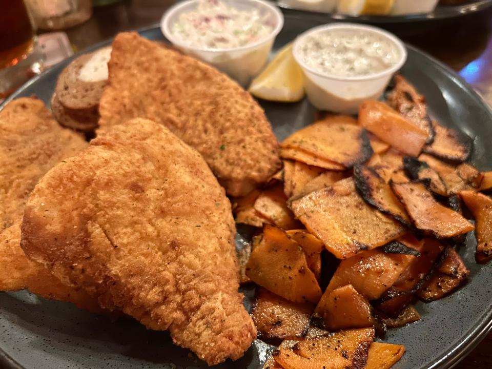 Bluegill is one of three fish varieties at The Swingin' Door Exchange, where you can add a signature a la carte side, like the restaurant's famous spicy vermouth carrots.