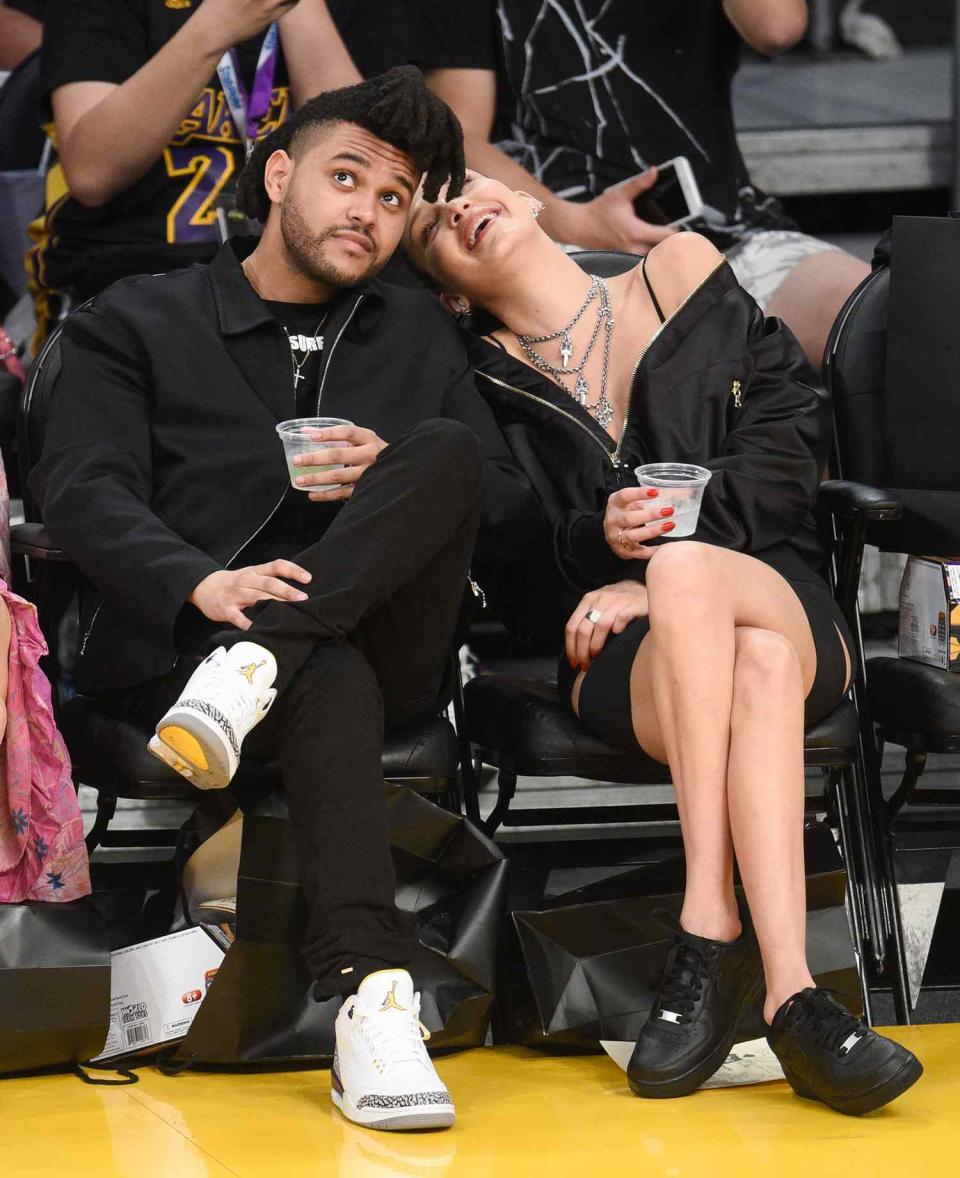 The Weeknd (L) and Bella Hadid attend a basketball game between the Utah Jazz and the Los Angeles Lakers at Staples Center on April 13, 2016 in Los Angeles, California