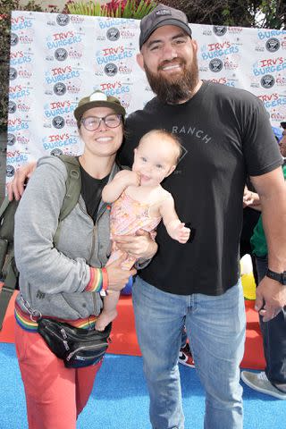 <p>Jeff Kravitz/FilmMagic</p> Rousey with husband Travis Browne and daughter