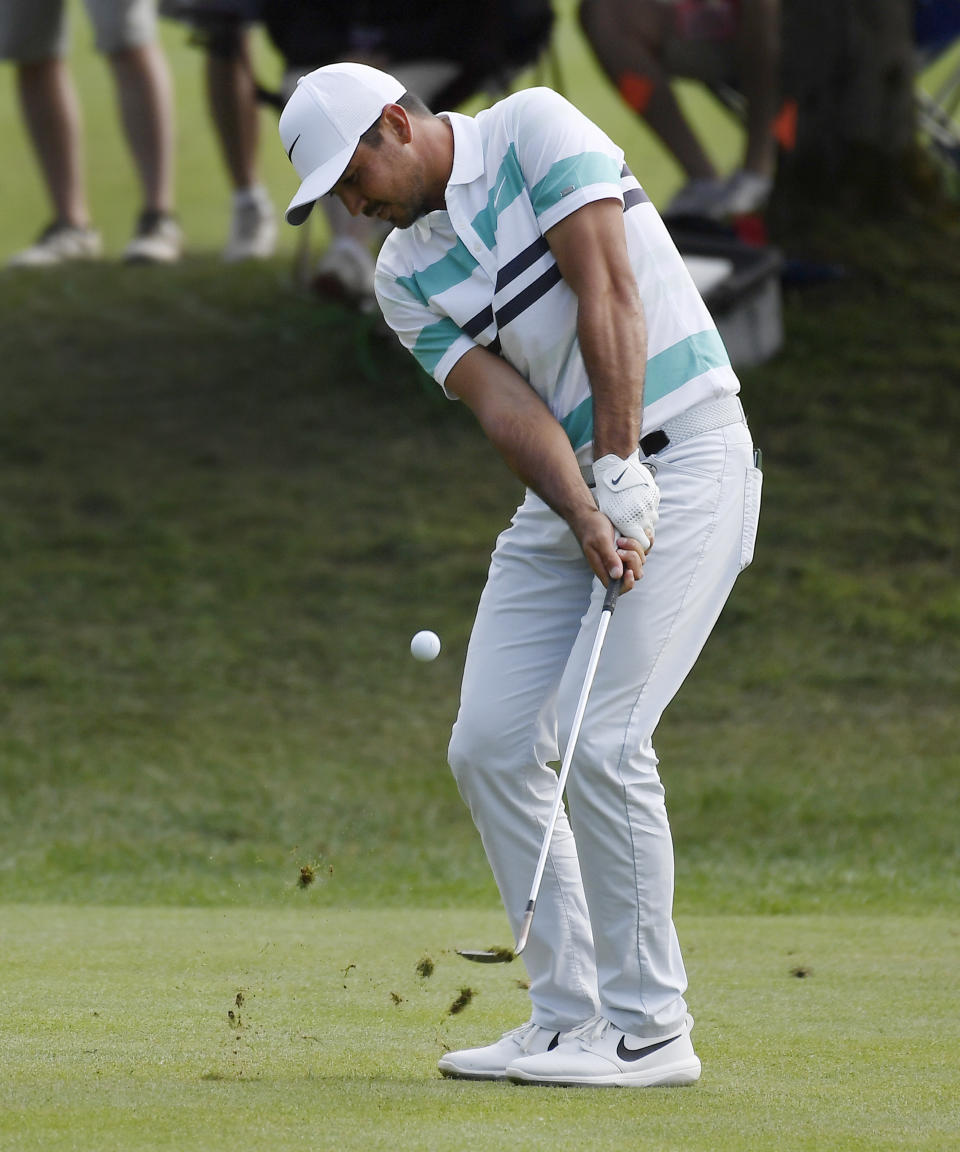 Jason Day hits his second shot on the 15th hole during the third round of the Travelers Championship golf tournament Saturday, June 22, 2019, in Cromwell, Conn. (AP Photo/Jessica Hill)