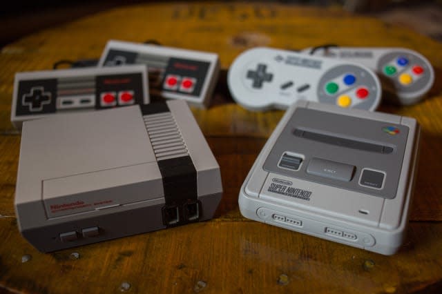 A NES (Nintendo Entertainment System) Classic Mini (L) and a