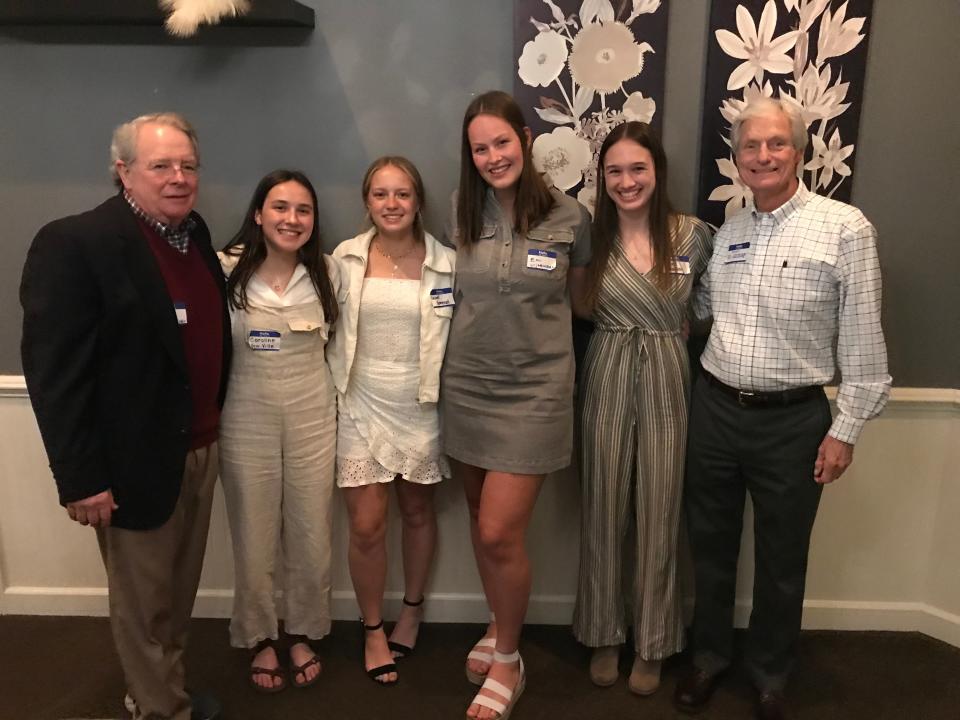 Pictured with Kiwanians Mike Whitaker, left and Ed Gesdorf are Memorial and Six District Scholarship winners  Caroline VonVille, Laurel Gomersal, Emi Uijtewall, and Hailey Walker.