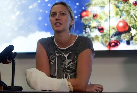 Czech Republic's tennis player Petra Kvitova speaks during a news conference, after she was injured on Tuesday when she fought off an intruder in her home, damaging all the fingers on her playing hand, in Prague, Czech Republic December 23, 2016. REUTERS/David W Cerny