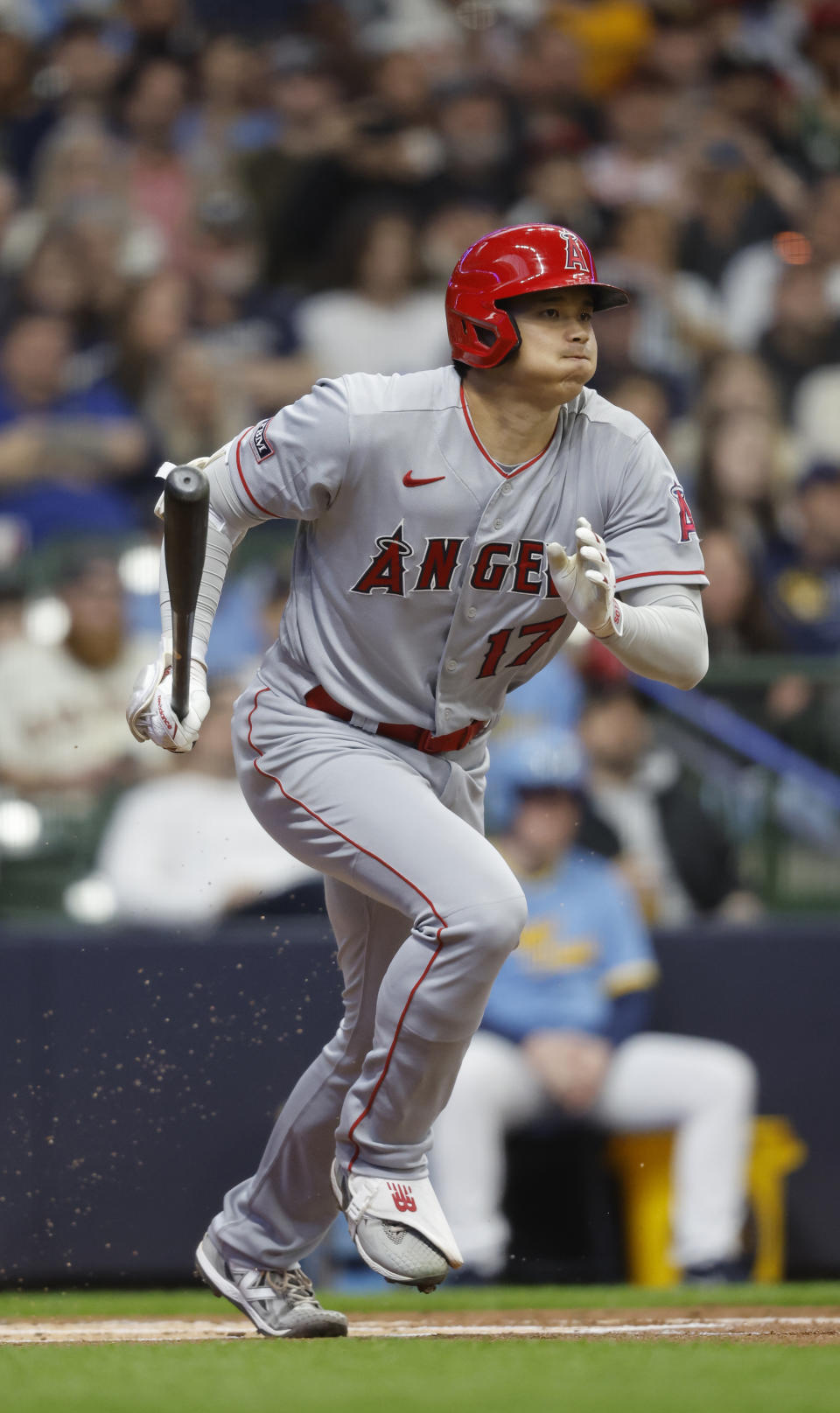 Los Angeles Angels' Shohei Ohtani hits into a fielder's choice against the Milwaukee Brewers during the first inning of a baseball game Friday, April 28, 2023, in Milwaukee. (AP Photo/Jeffrey Phelps)