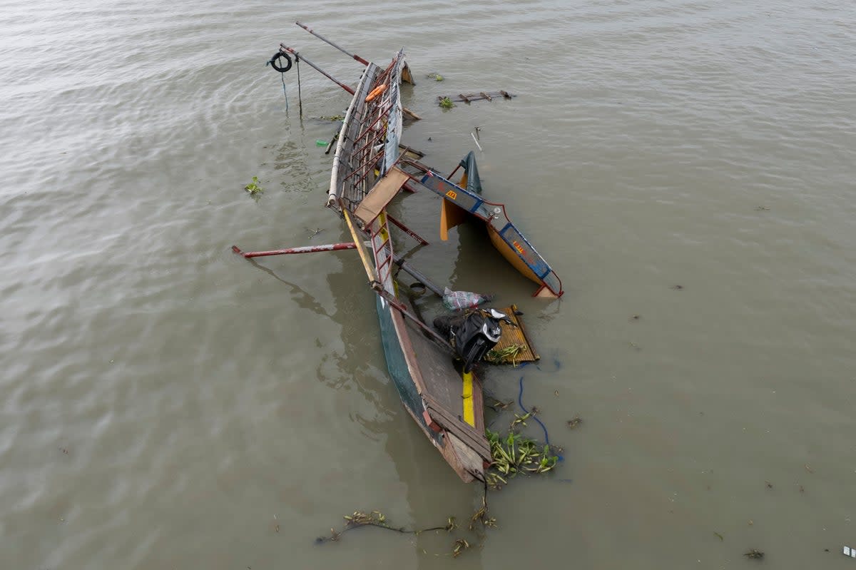 This photo taken by drone shows the remains of a passenger boat that capsized in Binangonan, Rizal province, Philippines on Friday (AP)