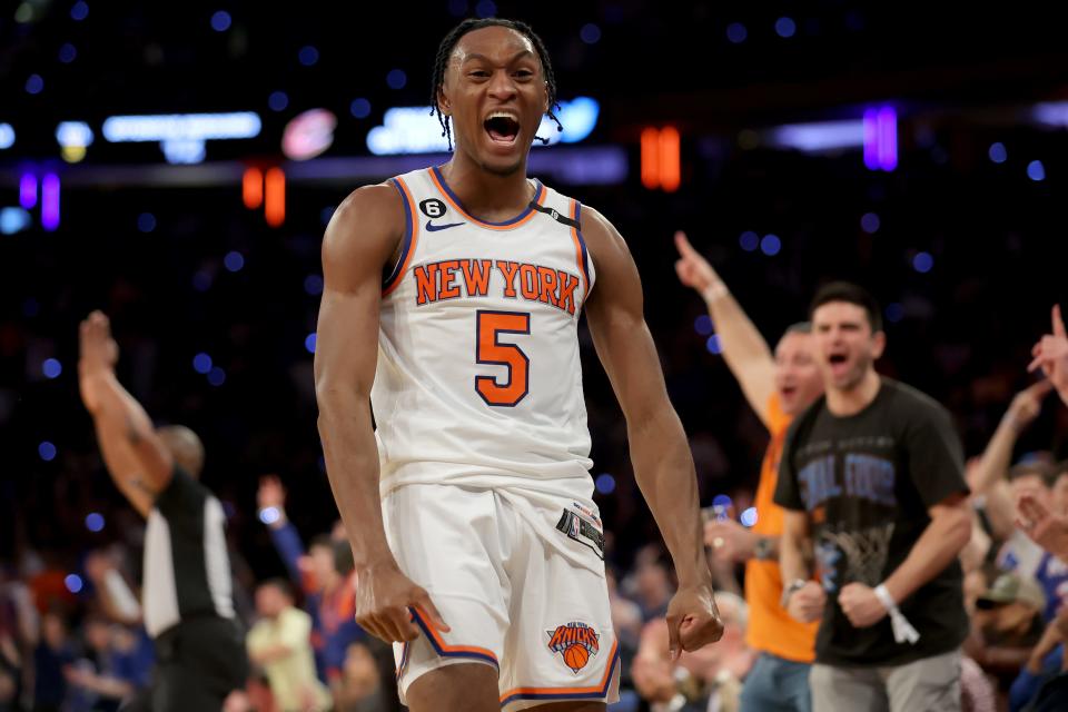 New York Knicks guard Immanuel Quickley reacts after a 3-point shot.