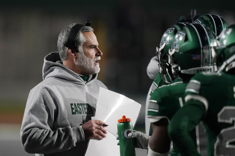 FILE - Eastern Michigan head coach Chris Creighton talks to his team during the second half of an NCAA college football game against Western Michigan, Tuesday, Nov. 16, 2021, in Ypsilanti, Mich. Eastern Michigan has been to four bowl games in the past five years under coach Chris Creighton but won its only title in 1987. (AP Photo/Carlos Osorio, File)