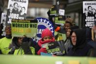People demonstrate for higher wages and better working conditions, outside of a Walmart during Black Friday shopping in Chicago November 28, 2014. REUTERS/Andrew Nelles