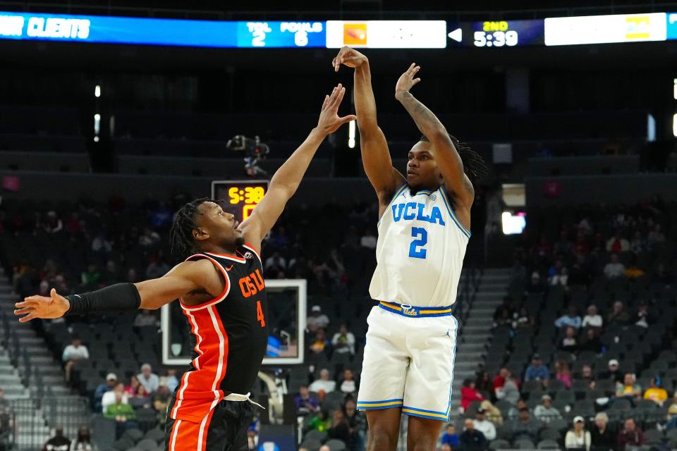 UCLA Bruins guard Dylan Andrews (2) shoots against Oregon State Beavers guard Dexter Akanno (4) during the second half at T-Mobile Arena Wednesday, March 13, 2024, in Las Vegas.