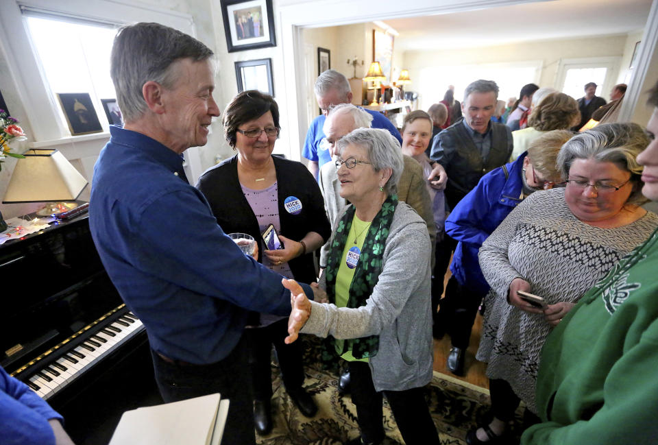 Former Colorado Gov. John Hickenlooper, one of the newest Democratic presidential candidates, greets attendees during a visit to the home of Jack Wertzberger in Dubuque, Iowa, on Saturday, March 9, 2019. (Jessica Reilly/Telegraph Herald via AP)