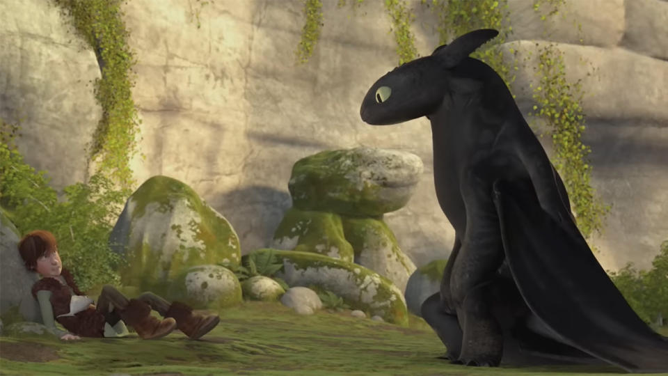 Hiccup and Toothless meet and eat fish in How To Train Your Dragon.