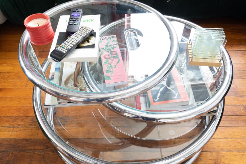 Glass and chrome coffee table in living room.