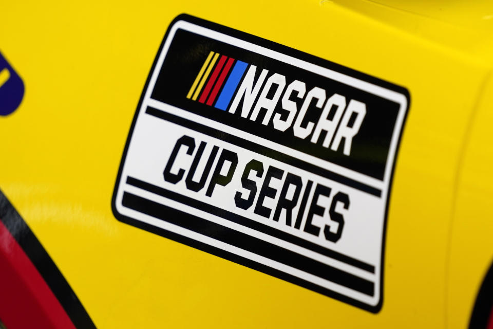 FILE - A NASCAR logo is seen on a car during auto race practice at Daytona International Speedway, Saturday, Feb. 19, 2022, in Daytona Beach, Fla. Teams report to Daytona International Speedway this week to prepare for Sunday's season-opening Daytona 500 without a new revenue sharing agreement that has been an ongoing sore spot between both NASCAR and its participants. (AP Photo/John Raoux, File)