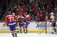 Washington Capitals center Evgeny Kuznetsov (92) celebrates his goal as New York Islanders right wing Jordan Eberle (7) looks on during the first period of an NHL hockey game, Tuesday, Dec. 31, 2019, in Washington. (AP Photo/Nick Wass)