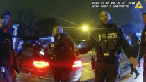 The image from video released on Jan. 27, 2023, by the City of Memphis, shows police officers talking after a brutal attack on Tyre Nichols by five Memphis police officers on Jan. 7, 2023, in Memphis, Tenn. Nichols died on Jan. 10. The five officers have since been fired and charged with second-degree murder and other offenses. (City of Memphis via AP)