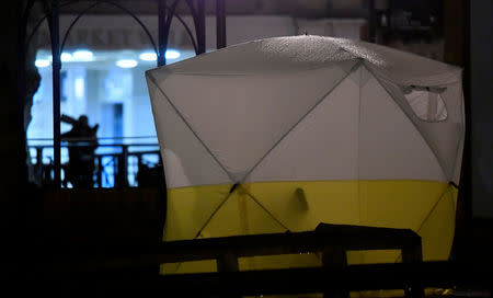 A tent is seen in an area cordoned off by police, after former Russian military intelligence officer Sergei Skripal, who was convicted in 2006 of spying for Britain, became critically ill after exposure to an unidentified substance, in Salisbury, southern England, March 5, 2018. REUTERS/Toby Melville