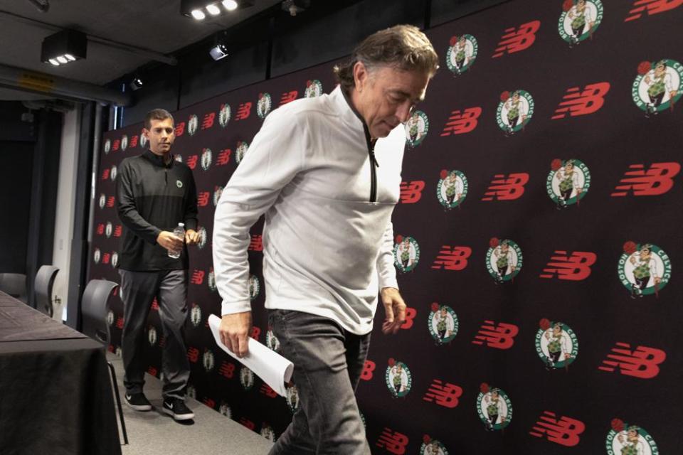 Boston Celtics owner Wyc Grousbeck, right, and president of basketball operations Brad Stevens leave after speaking during a news conference, Friday, Sept. 23, 2022, in Boston. (AP Photo/Michael Dwyer)
