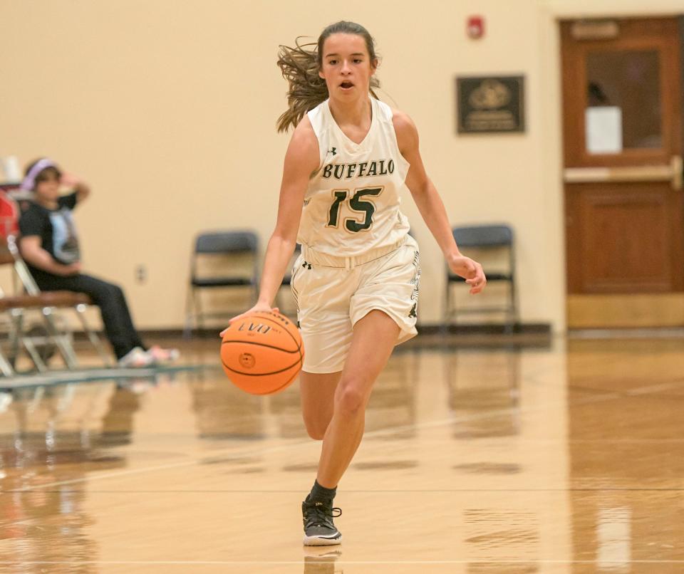 The Villages’ Evah Watterson (15) drives to the basket against Tavares on Monday in The Villages. Watterson had 13 points in the Buffalo's 57-17 win. [PAUL RYAN / CORRESPONDENT]