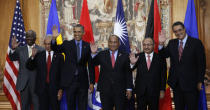 U.S. President Barack Obama poses for a family photo with leaders of island nations under threat by rising sea levels during the World Climate Change Conference 2015 (COP21) in Paris, France, December 1, 2015. REUTERS/Kevin Lamarque