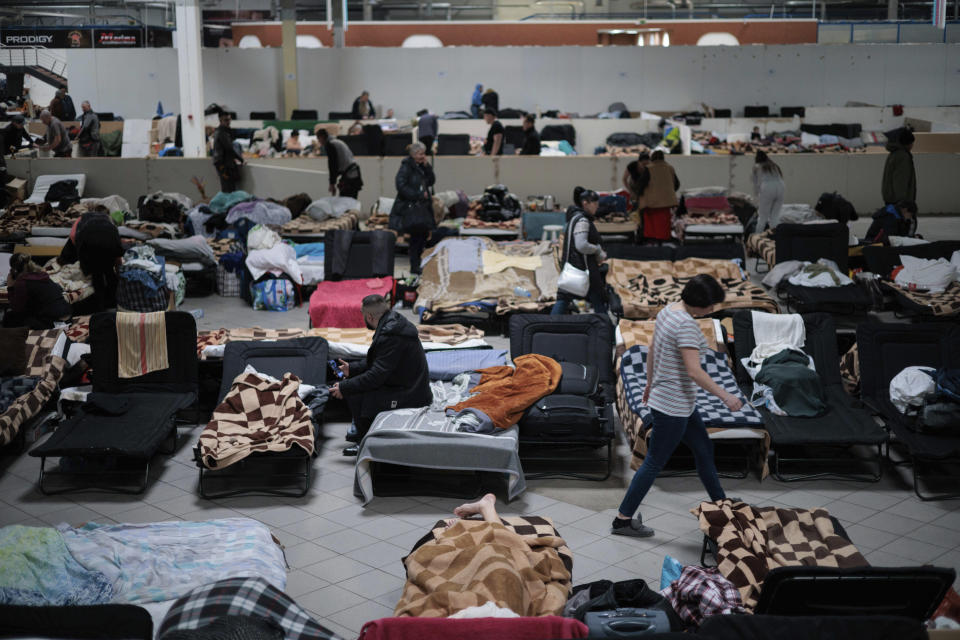 Ukrainian refugees rest at a refugee center in Nadarzyn, near Warsaw, Poland, Tuesday, Feb. 14, 2023. Nearly a year has passed since the Feb. 24, 2022, invasion sent millions of people fleeing across Ukraine's border into neighboring Poland, Slovakia, Hungary, Moldova and Romania. (AP Photo/Michal Dyjuk)