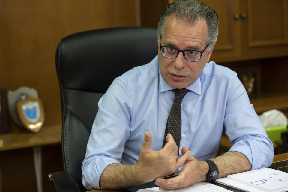 Alternate Minister for immigration policy in the ministry of Citizen's Protection of Greece, George Koumoutsakos speaks to the Associated Press during an interview, in Athens, on Friday, Sept. 27, 2019. Authorities in Greece say seven people have died Friday after a boat carrying migrants sank in the eastern Aegean Sea. (AP Photo/Petros Giannakouris)