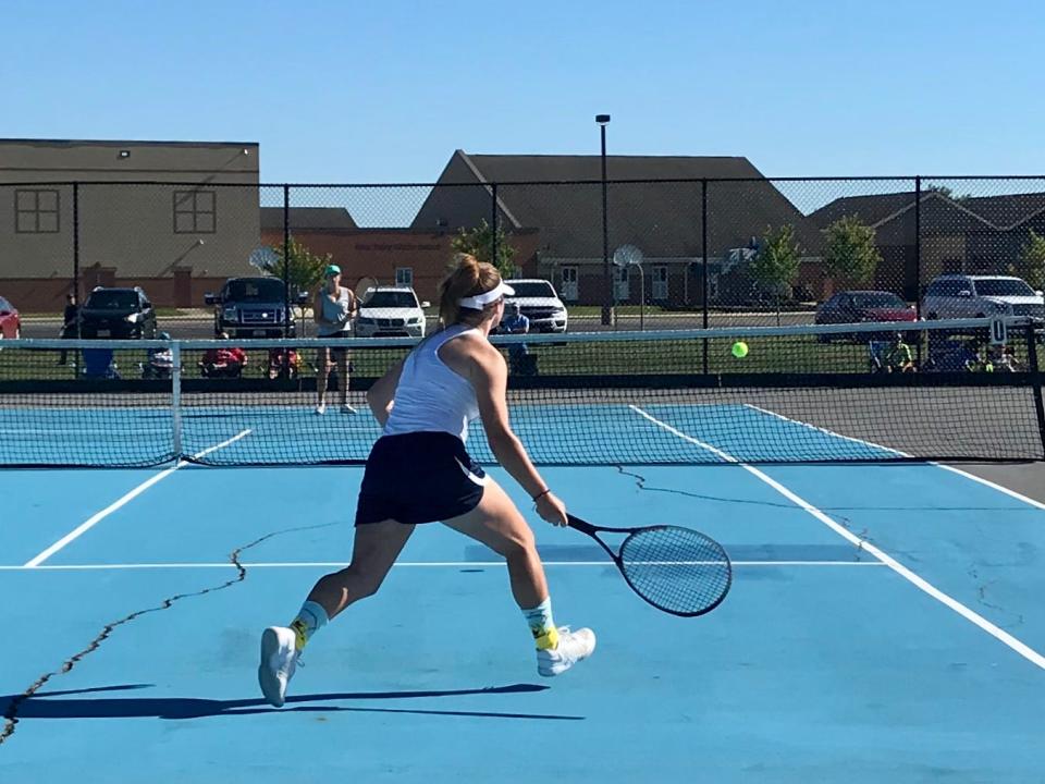 In a file photo from four years ago featuring former River Valley girls tennis player Olivia Kaufman, wide cracks are noticeable in the court.