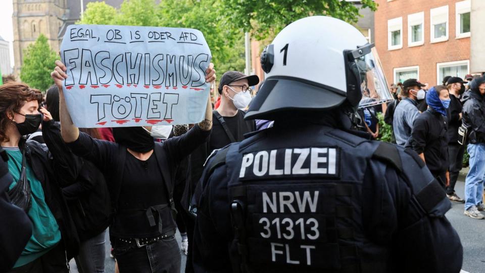 PHOTO: A demonstrator holds a sign that reads 'fascism is killing,' as far-right protesters gather in the German city of Solingen, following a stabbing rampage in which several individuals were killed and injured, in Solingen, Germany, Aug. 25, 2024. (Wolfgang Rattay/Reuters, FILE)