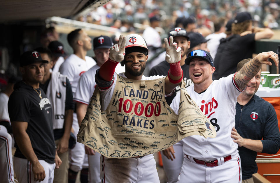 MINNEAPOLIS, MINNESOTA - SEPTEMBER 9: Willi Castro (C) #50 of the Minnesota Twins celebrates with Christian Vazquez #8 in the dugout after hitting a home run in the eighth inning against the New York Mets at Target Field on September 9, 2023 in Minneapolis, Minnesota. (Photo by Stephen Maturen/Getty Images)