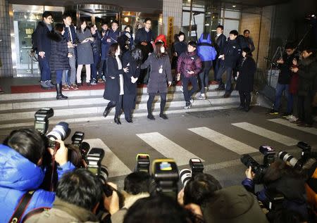 Cho Hyun-ah (C), also known as Heather Cho, daughter of chairman of Korean Air Lines, Cho Yang-ho, leaves for a detention facility after a court ordered her to be detained, at the Seoul Western District Prosecutor’s office December 30, 2014. REUTERS/Kim Hong-Ji