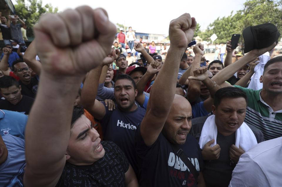 Defected Venezuelan Bolivarian National Guards and soldiers shout slogans against Venezuela's President Nicolas Maduro in La Parada near Cucuta, Colombia, Tuesday, April 30, 2019. Venezuelan opposition leader Juan GuaidÃ³ took to the streets in Caracas with activist Leopoldo Lopez and a small contingent of heavily armed troops early Tuesday in a bold and risky call for the military to rise up and oust socialist leader Nicolas Maduro. (Photo: Fernando Vergara/AP)