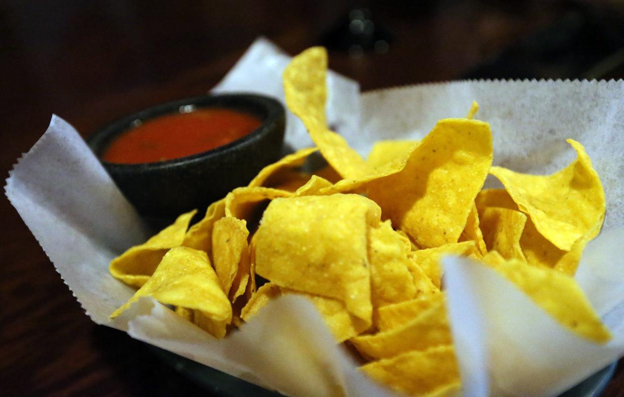 A customer enjoys chips and salsa at Cinco de Mayo Bar & Grill in Dover Monday, July 11, 2022.