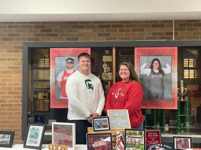 Norwayne's Colby Morlock and Grace Sparks take some photo op time after making their futures official in a ceremony at their high school.