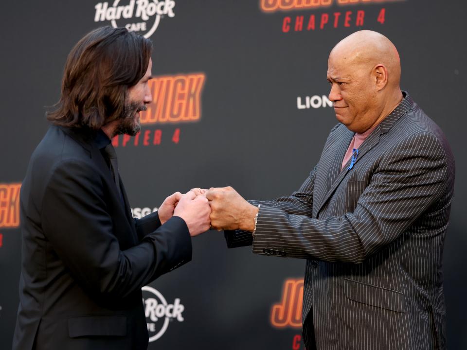 Keanu Reeves and Laurence Fishburne attends the Los Angeles Premiere of Lionsgate's "John Wick: Chapter 4" at TCL Chinese Theatre on March 20, 2023 in Hollywood, California.