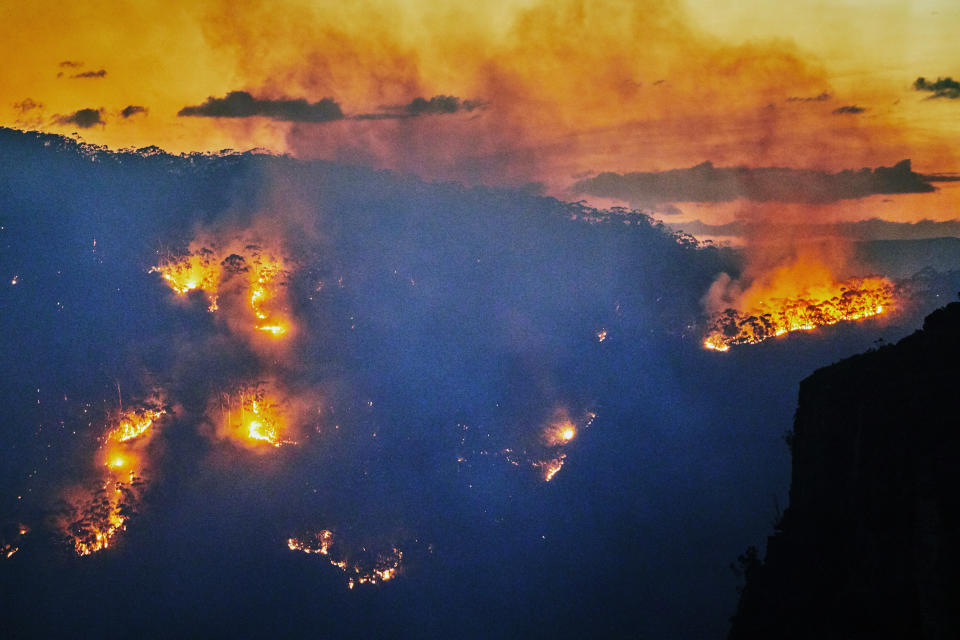 Fires in Jamison Valley, Katoomba, Blue Mountains, Australia. Climate change is causing extreme weather, prolonged droughts and increasing bushfires