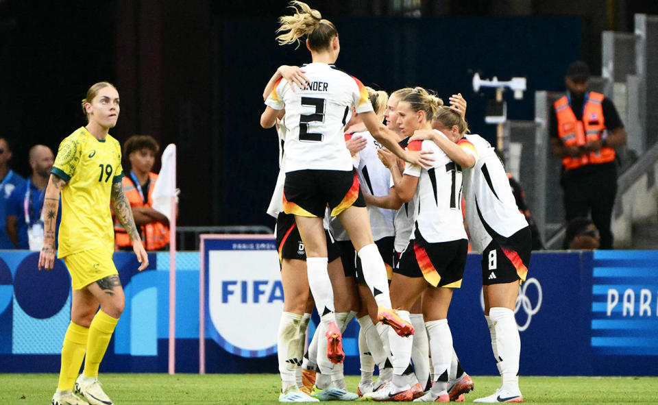 German players celebrate during their win over the Matildas at the Olympics.