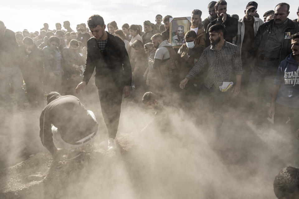 FILE -- Syrian Kurds attend a funeral of people killed in Turkish airstrikes in the village of Al Malikiyah, northern Syria, Monday, Nov. 21, 2022. Turkish airstrikes on northern Syria over the weekend that killed and wounded a number of Syrian soldiers could pose a setback to the recent move toward a rapprochement between the two countries after 11 years of tension and hostility. (AP Photo/Baderkhan Ahmad, File)