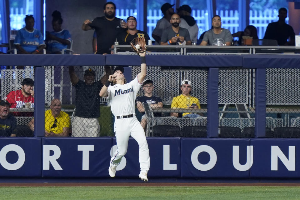 Miami Marlins left fielder Luke Williams catches a ball hit by Pittsburgh Pirates' Michael Chavis during the fifth inning of a baseball game, Thursday, July 14, 2022, in Miami. (AP Photo/Wilfredo Lee)