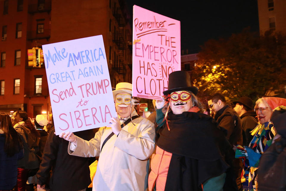 <p>People wear political costumes and carry anti-Trump placards in the 44th annual Village Halloween Parade in New York City on Oct. 31, 2017. (Photo: Gordon Donovan/Yahoo News) </p>