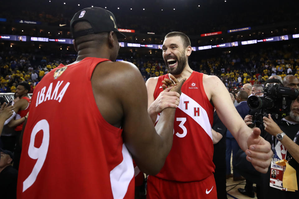 OAKLAND, CALIFORNIA - JUNE 13: Serge Ibaka #9 and Marc Gasol #33 of the Toronto Raptors celebrates their teams victory over the Golden State Warriors in Game Six to win the 2019 NBA Finals at ORACLE Arena on June 13, 2019 in Oakland, California. NOTE TO USER: User expressly acknowledges and agrees that, by downloading and or using this photograph, User is consenting to the terms and conditions of the Getty Images License Agreement. (Photo by Ezra Shaw/Getty Images)