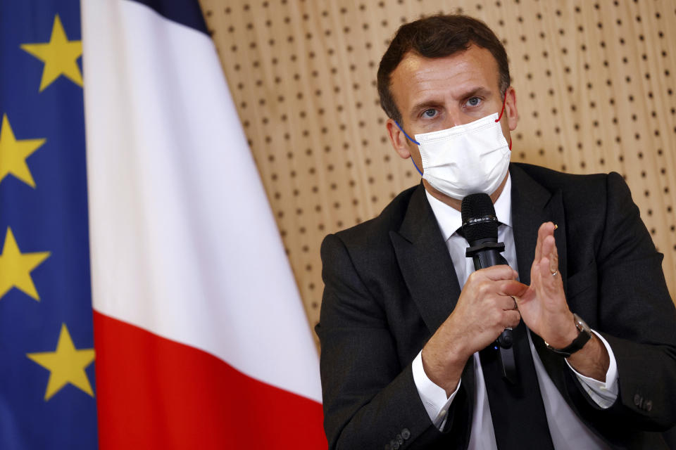 French President Emmanuel Macron, wearing a protective face mask, talks during a meeting with medical staff members during a visit in a child psychiatry department at Reims hospital, eastern France, to discuss the psychological impact of the COVID-19 crisis and the lockdown on children and teenagers in France, Wednesday, April 14, 2021. (Christian Hartmann/Pool via AP)