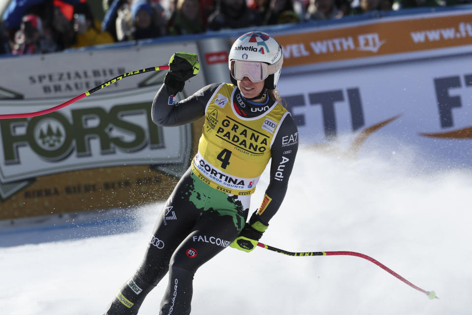 Italy's Marta Bassino celebrates at the finish area of an alpine ski, women's World Cup super-G, in Cortina d'Ampezzo, Italy, Sunday, Jan. 22, 2023. (AP Photo/Alessandro Trovati)