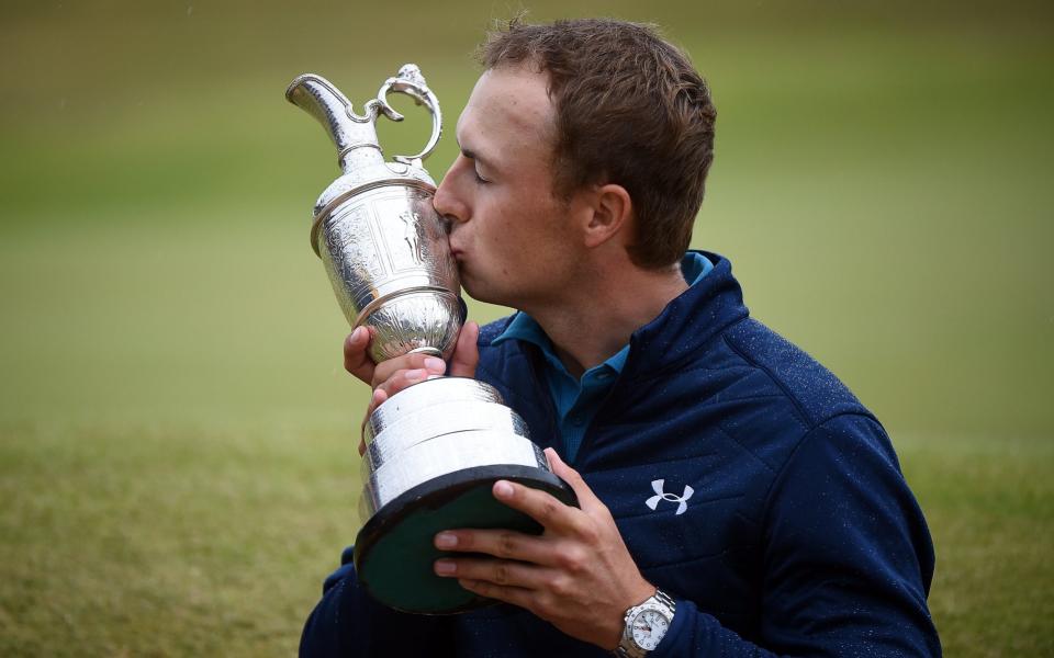 Jordan Spieth of the US kisses the Claret Jug trophy after winning the British Open - Credit: EPA