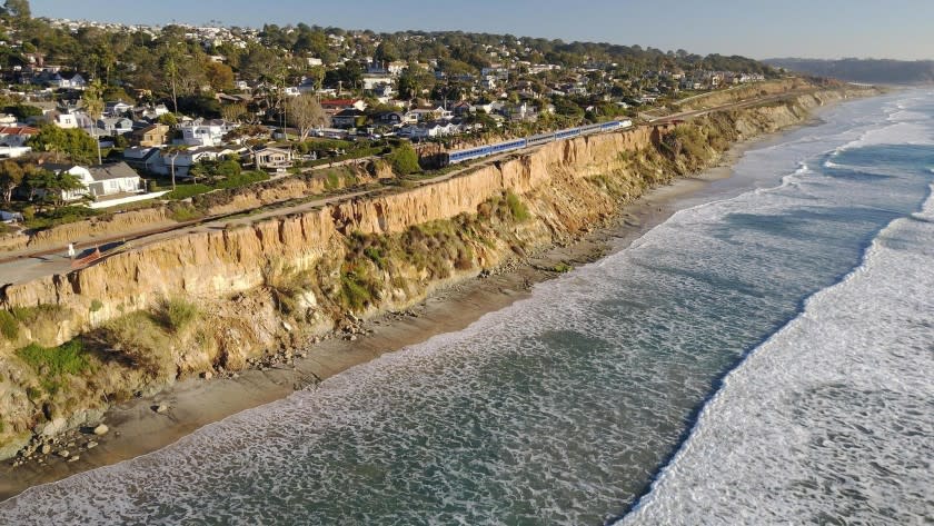 DEL MAR, CA. DEC 11, 2018,-For the fourth time this year the bluffs above the beach in Del Mar between 9th and 10th streets have stuffed off on to the beach below. Officials are worried that the continuing erosion is putting the train tracks that sit close to the cliffs edge in jeopardy. PHOTO/JOHN GIBBINS Staff photographer, San Diego Union-Tribune. ©2018