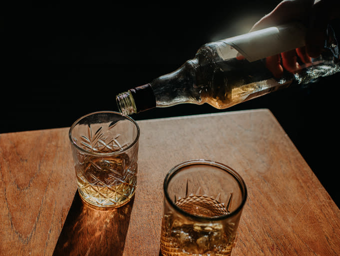 alcohol being poured into a glass