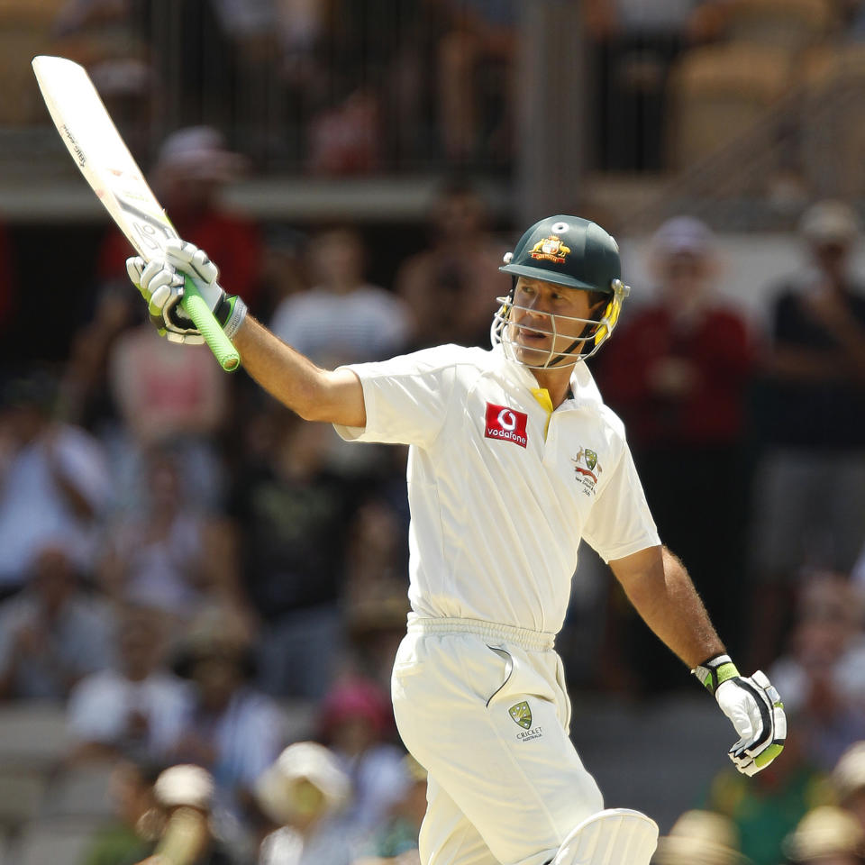 Ricky Ponting celebrates reaching 50 runs during the first day of the fourth test cricket match against India in Adelaide, January 24, 2012. (REUTERS/Brandon Malone)